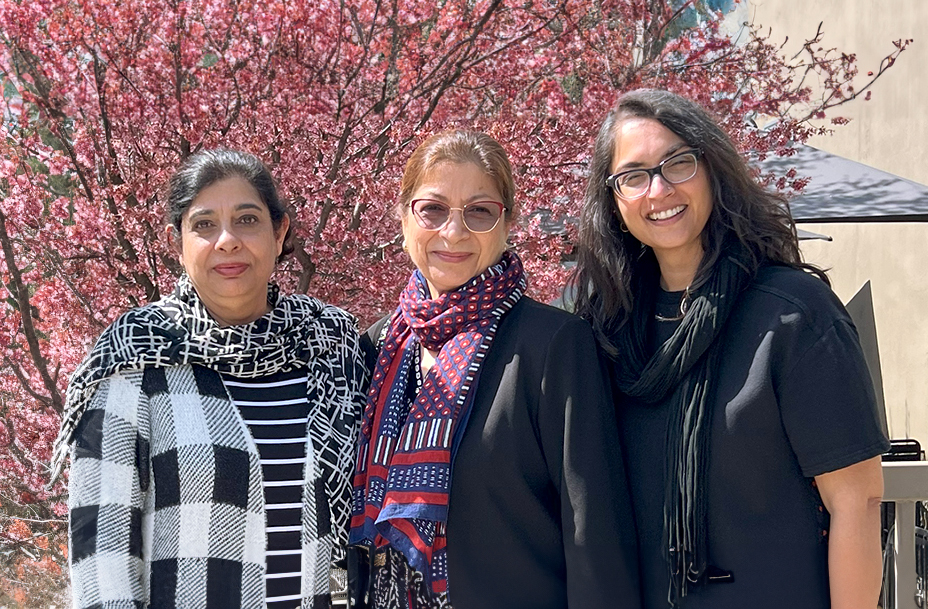 Image of three of the four founders of RENEW standing side by side outdoors - Kaisra, Shanaz and Asma.